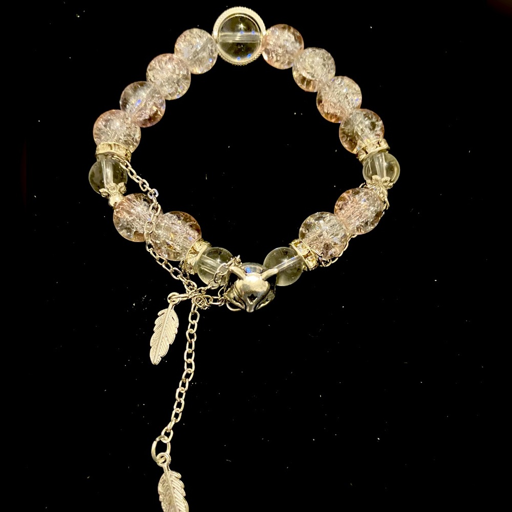 Silver and clear crystal bracelet with heart charm and feather charm
18cm/7.08in